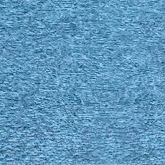 Light blue fabric texture sample with irregular fibers, horizontal striations, and a tactile finish; “egoitaliano Dalia 21” text visible.